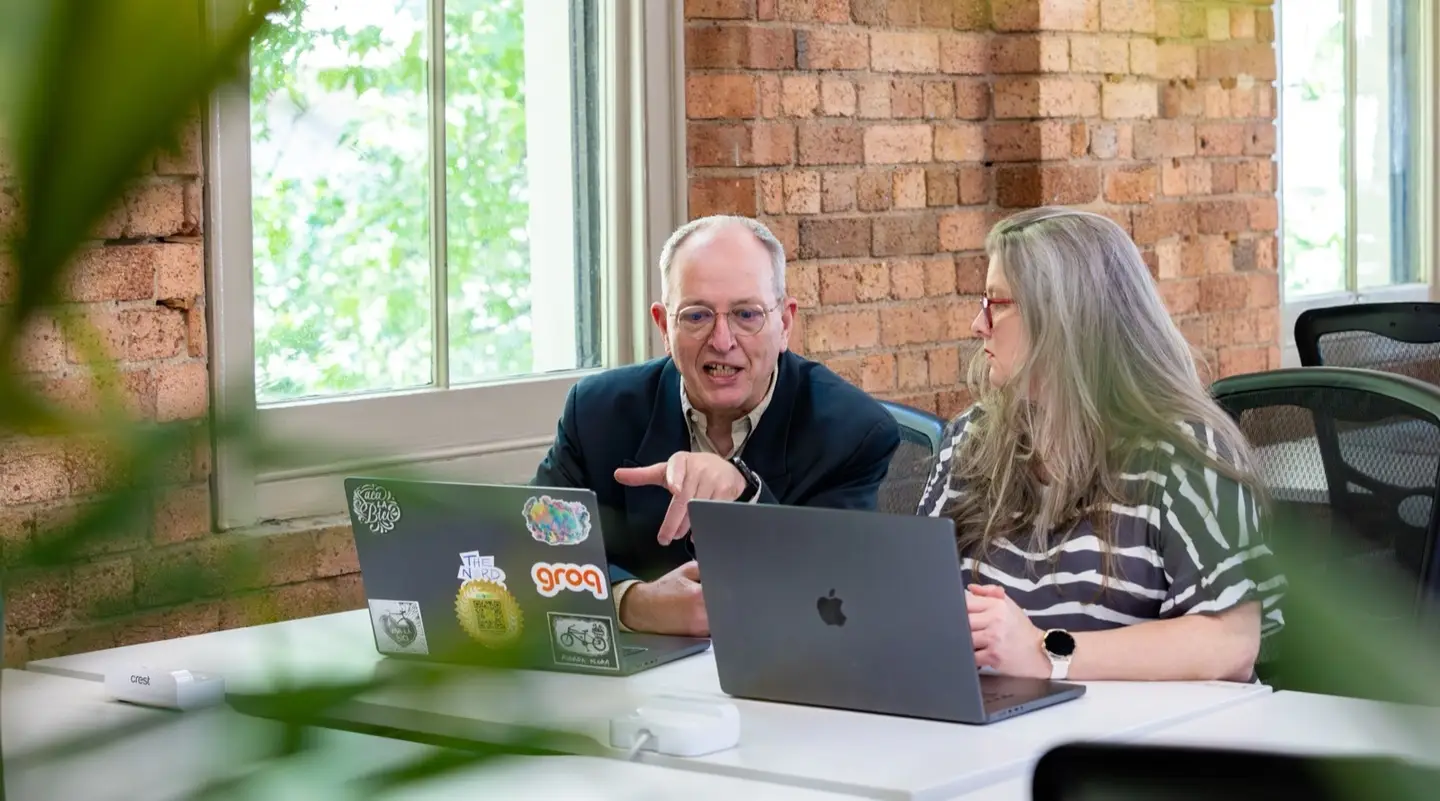 Tracy and Dennis working together at Real Minds AI