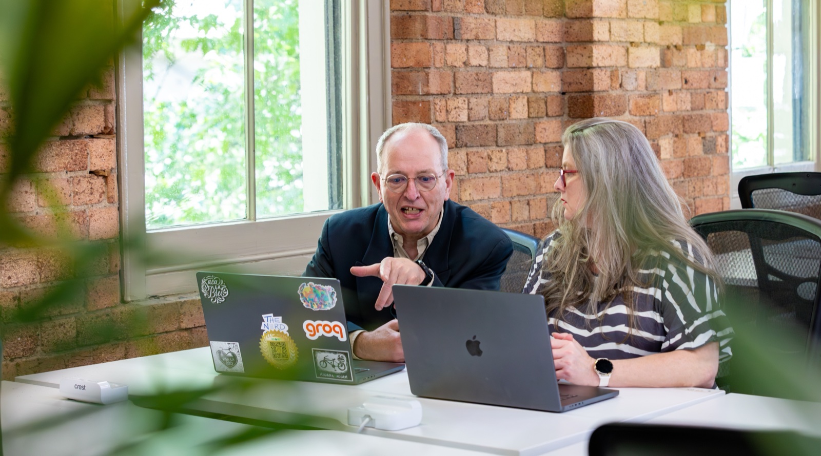 Tracy and Dennis working together at Real Minds AI